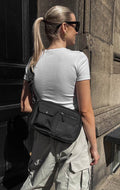 Sac bandoulière DarlaMBG. Taille M. Noir. 100 % polyester recyclé. Markberg