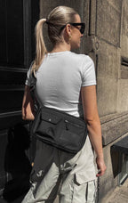 Sac bandoulière DarlaMBG. Taille M. Noir. 100 % polyester recyclé. Markberg